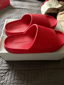 Red Nike slides