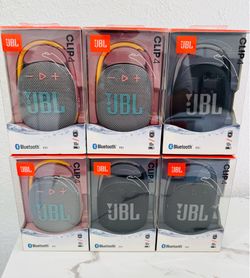 New JBL Clip 4 portable speakers in original boxes. These compact Bluetooth speakers have an integrated carabiner for easy attachment. Each unit is wa