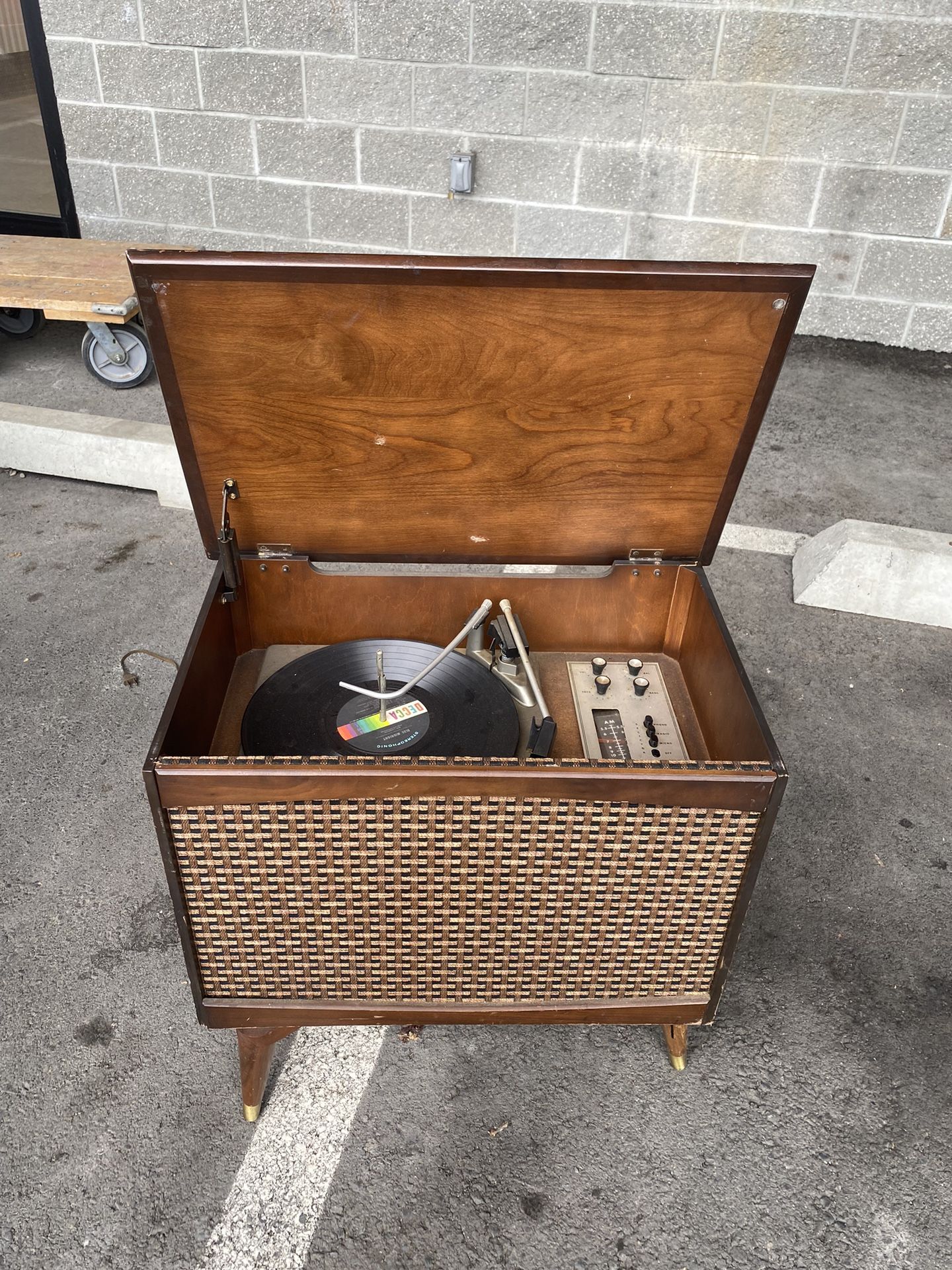 Vintage record player console with microphone. We just acquired this in a lien storage unit auction full of vintage collectibles It has not been teste