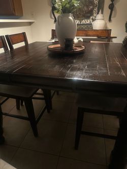 Dining room table with chairs and bench