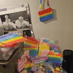 Many pop it sensory toys. There is approximately 100 of them make offer for some or all. 