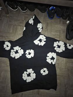 Black denim tear with white flowers