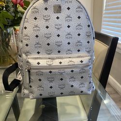 medium silver mcm backpack stark side studs visetos 
