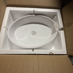 new white oval ceramic vessel sink