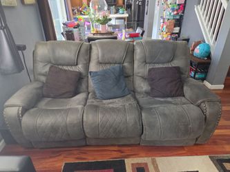 Gray Reclining Sofa with Nailhead Trim