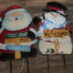 Two metal yard ornaments