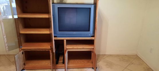 Small oak entertainment  center. 53 inches tall, 55 inches wide and 16 inches  deep