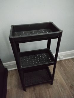 Small adjustable plastic shelf