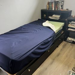 Twin Bed With Mattress And Storage And A Bookshelf Headboard