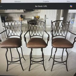 Three 30” Swivel Iron Bar Stools