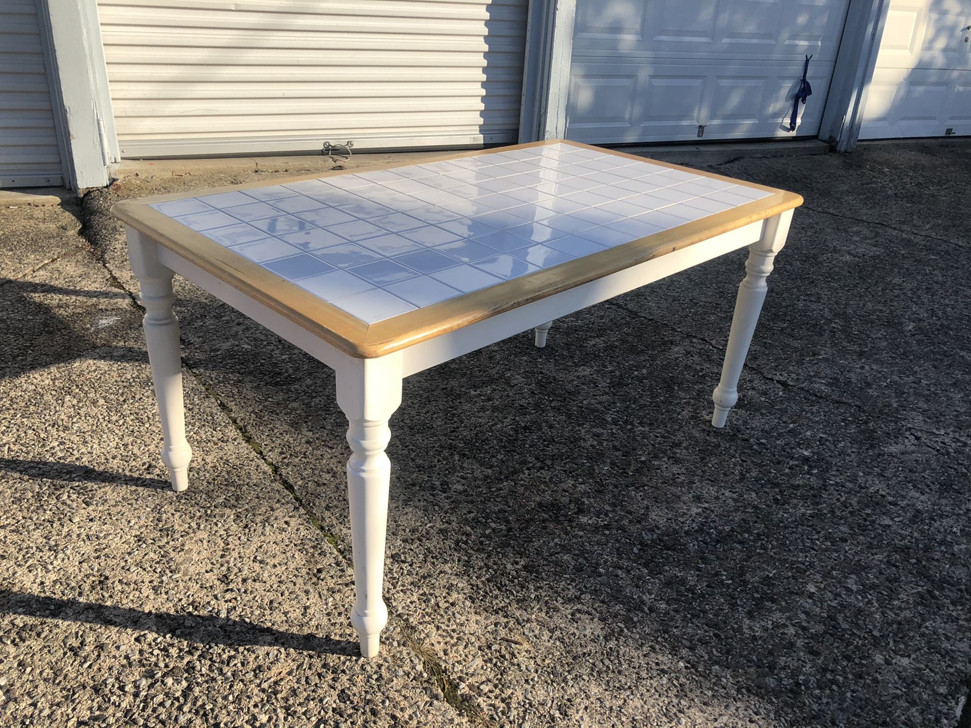 White tile top table with wood trim