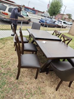 Eight chair dining table real wood real leather
