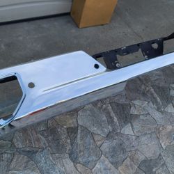 2019 - 2023 CHEVROLET SILVERADO GMC SIERRA REAR BUMPER CHROME W/HOLE SENSORS GENUINE USED OEM.  Y2
