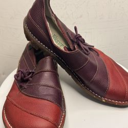 These are women's El Naturalista Mary Jane leather shoes in red and burgundy colors.