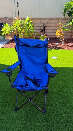 Foldable chair with sun, cover, and drink holder, perfect for the beach or those long concerts.