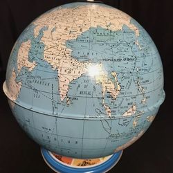 Vintage Ohio Art Company Tin World Globe with landmark base.