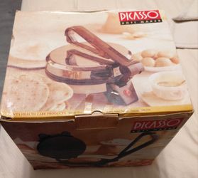 Brand new roti / chapti maker machine in box ( never used ).