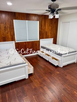 White twin bed and mattress with drawers