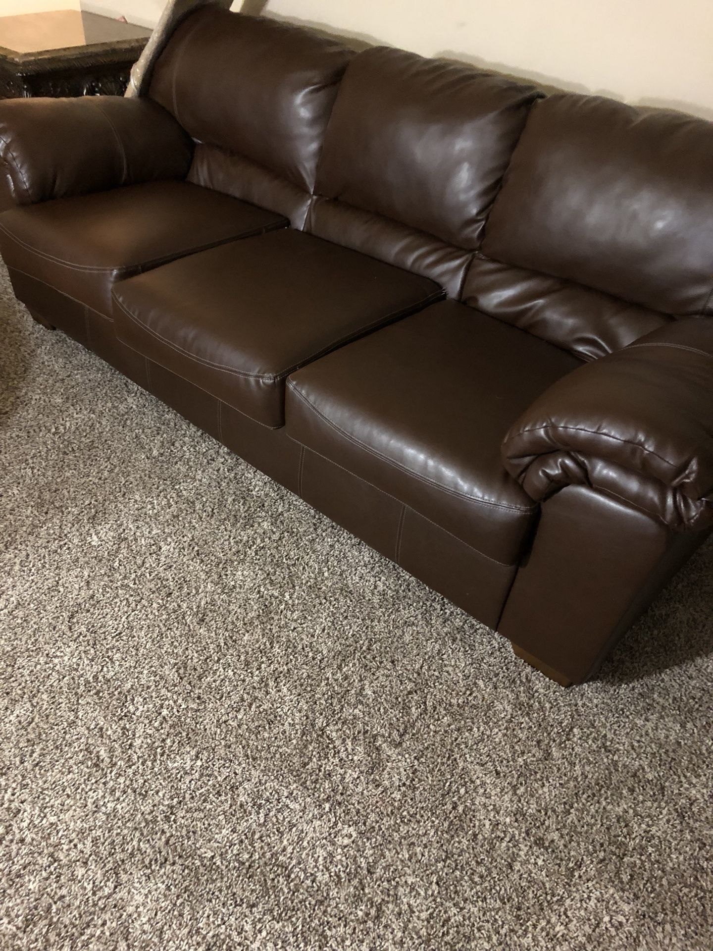 Brown leather sofa and loveseat