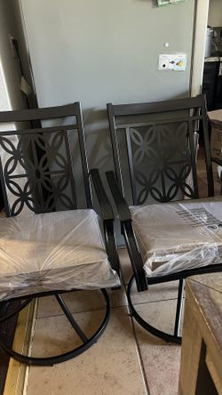 Two Out Door Swivel Chairs 