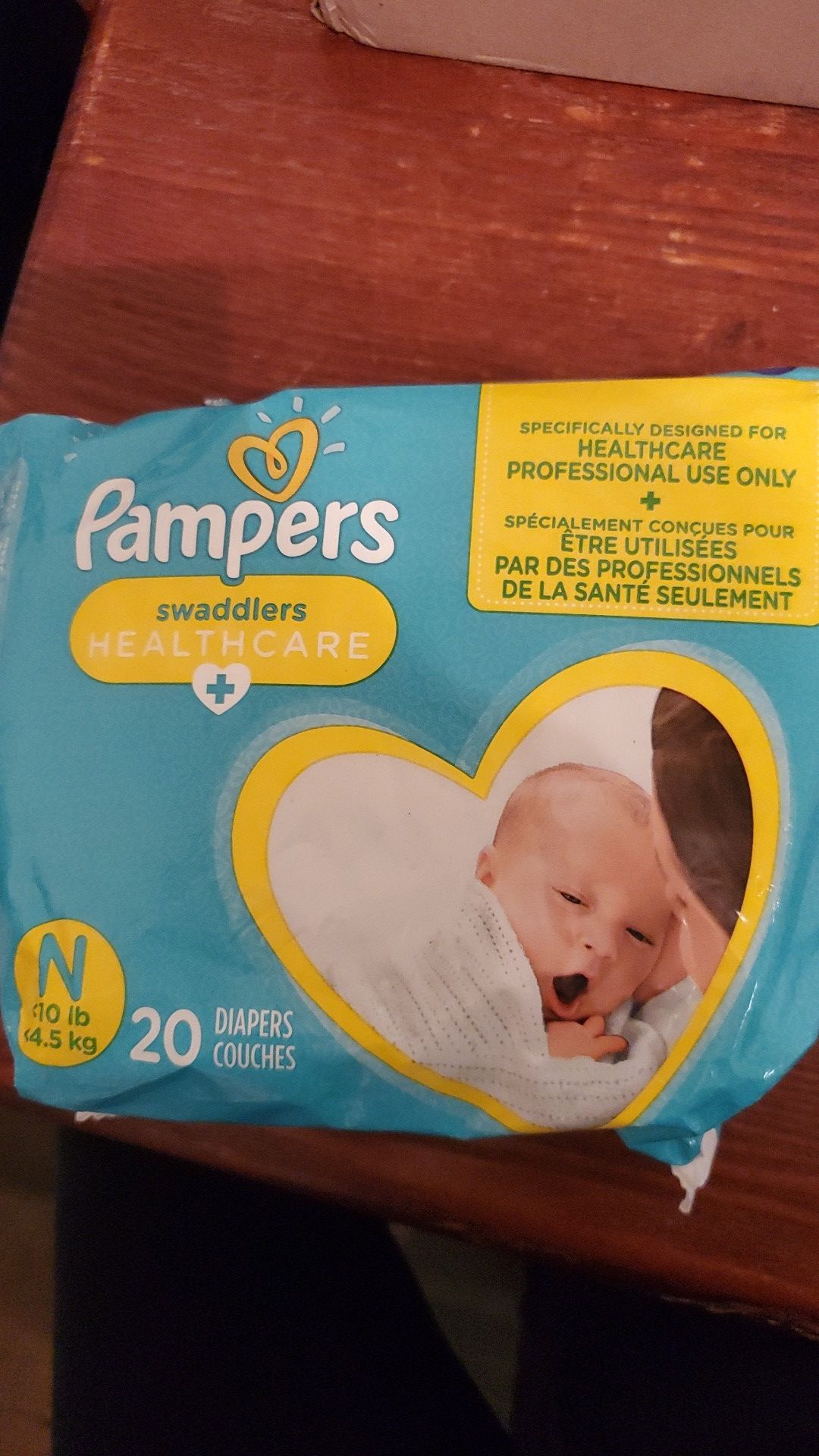 New bag of Pampers new born