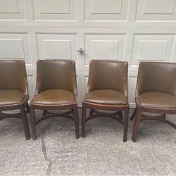 Four Vintage Wood And Leather Chairs