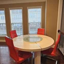 White Table With Red Leather Chairs