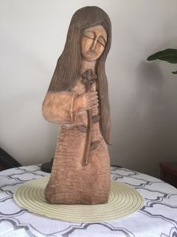 “Madonna “ made by carver in wood on 2D .