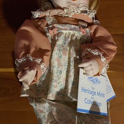 HERITAGE MINT LTD VINTAGE -1992 Porcelain Doll Baby-Girl in pink pajamas sitting position. 