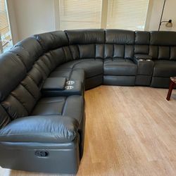 New Reclining Sectional .  Grey Gel Leatherette .  123” X 123”.  Free Delivery !