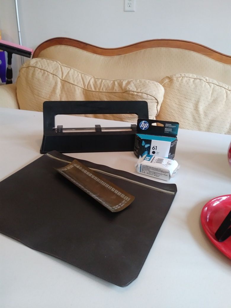 Office supplies: hp printer ink, hole punch, antique pen tray and file pouch.