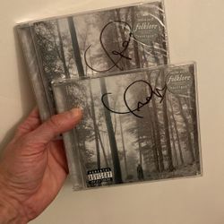 Two Autographed Taylor Swift Folklore CD’s