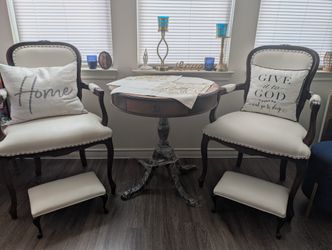 stunning antique entry table paired with matching chairs.