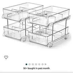 A Set Of 2, 2 Tier Sliding Storage Containers