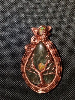 Intricate handmade Labradorite and Ethiopian opal pendant