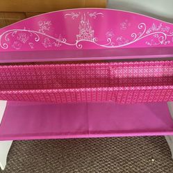 Pink Disney Princess-themed book organizer with multiple fabric shelves.