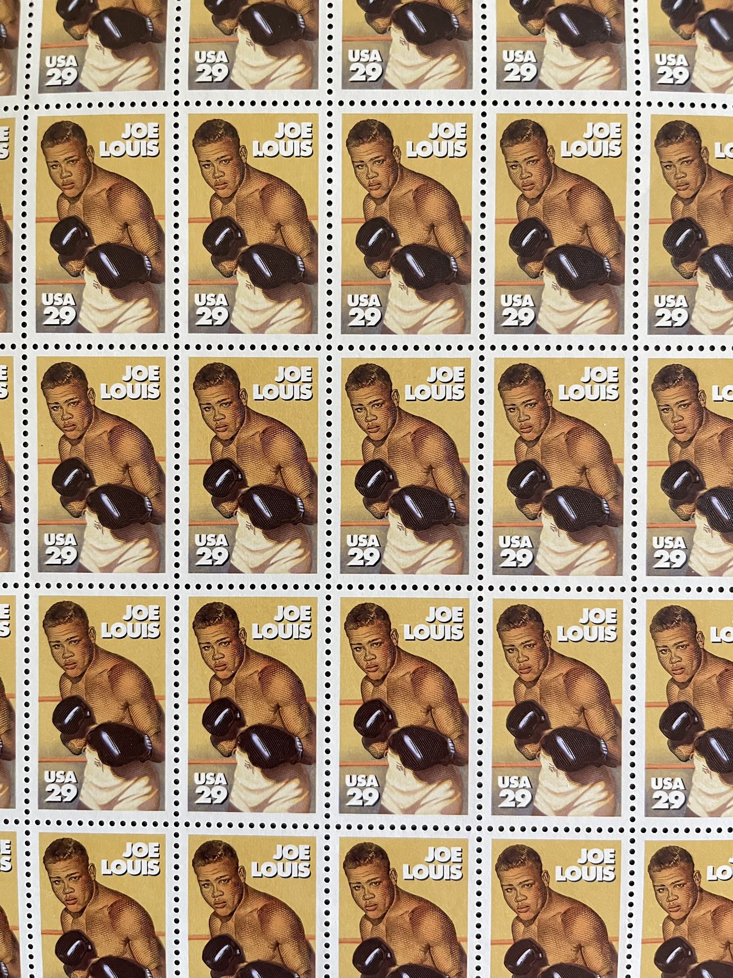 U.S. Postage Stamps Of All Time Great Heavyweight Boxing Champion Joe Louis Of The 1930s-1940s. Includes One Sheet Of 50 Stamps. Never Used. Mint. 