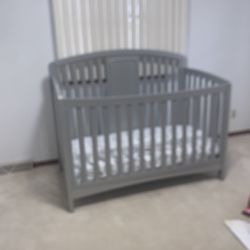 Gray Baby Crib In Good Condition With Mattress 