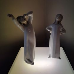 Lladro Figurines-Pair "Boy Awakening" and "Girl Stretching." 