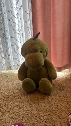 Dinosaurio de peluche