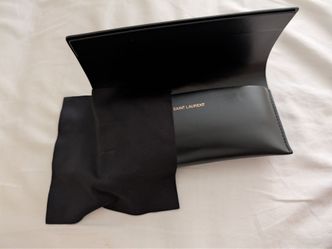 Saint Laurent sunglasses with black leather case sleeve