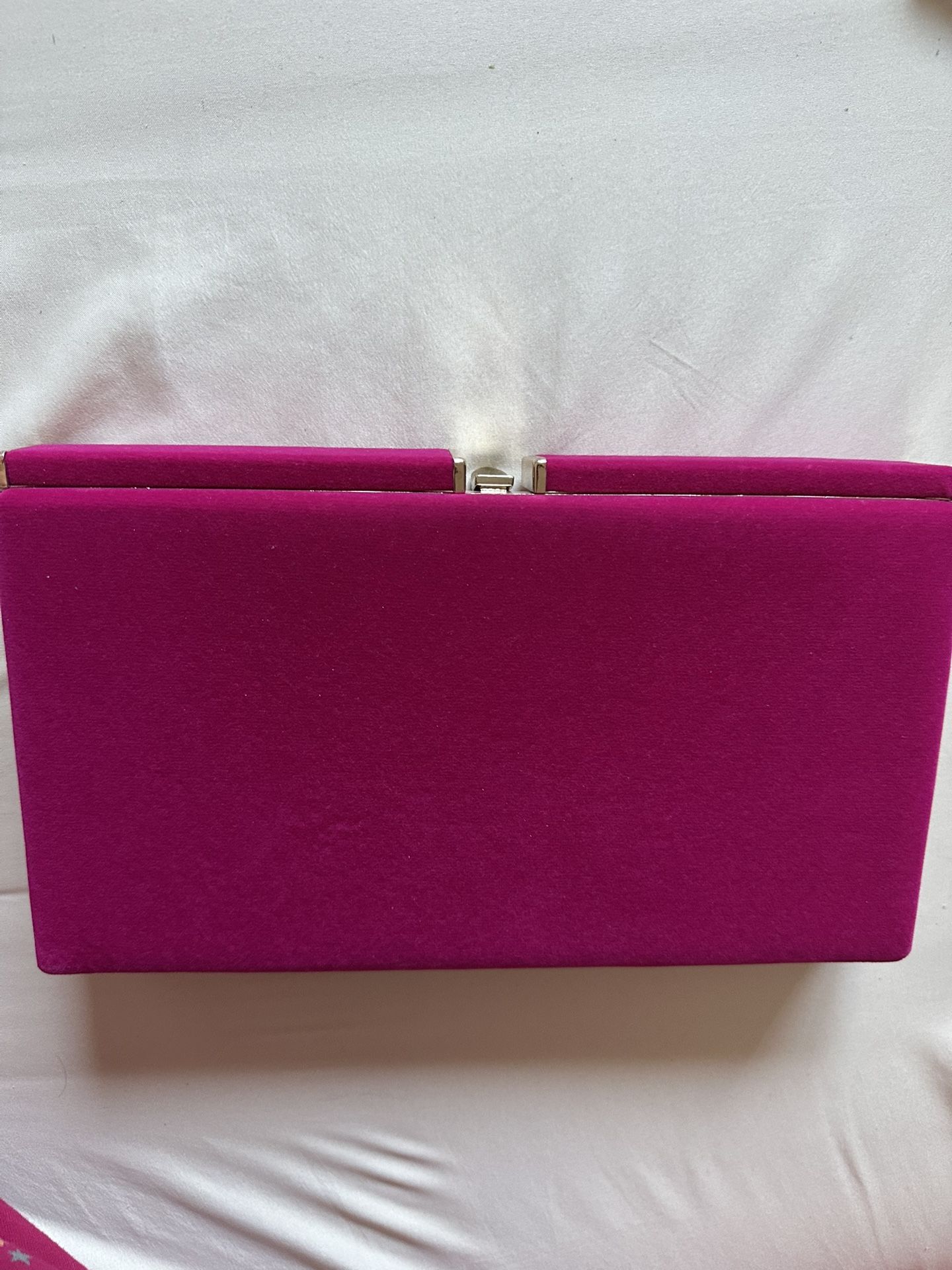 Pink velvet clutch purse with gold trimmings and black interior. New