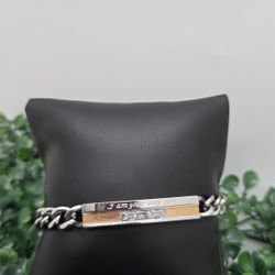 Sleek two tone silver stainless steel curb chain bracelet. Unisex