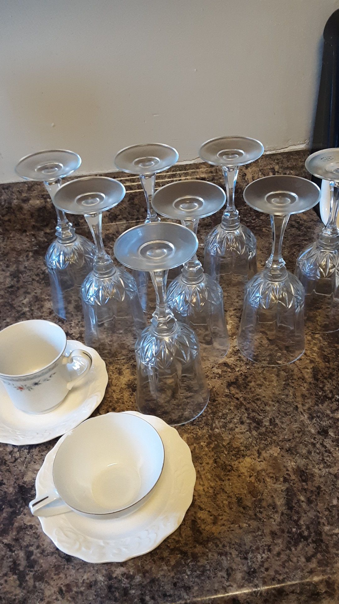 9 Wine glasses and 2 tea cups with plate