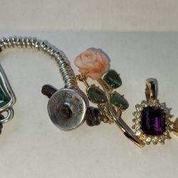 Lot of 4 jewelry pieces.  The bundle includes 

1. Rolled in 18k single Rose yellow. 

2.  Silver .925 Bracelet With Emerald Baguette Style Cut Stone.