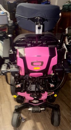 Preowned like new Pink Quantum Edge series power wheelchair equipped with complex rehab seating. Has charger and EVERYTHING works just fine. Located o