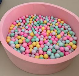 Very Large Round Pink Foam Toddler Ball Pit filled with around 800 colorful pastel plastic balls