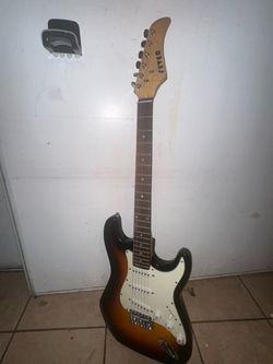 used Fever electric guitar with a gig bag