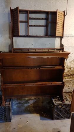 Colonial Hutch in the basement next to the record player for 15 years little teacups on it