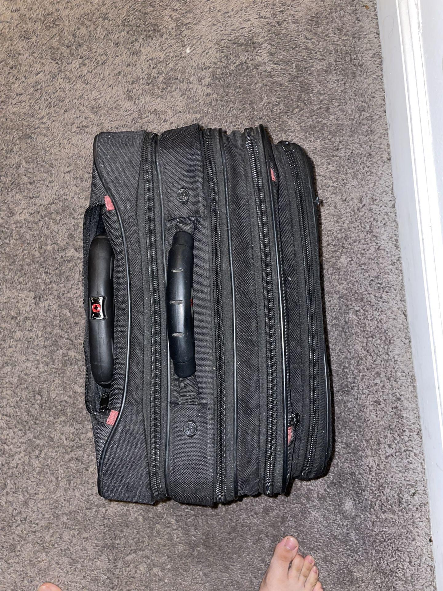 “Compact Black Fabric Suitcase with Multiple Compartments”